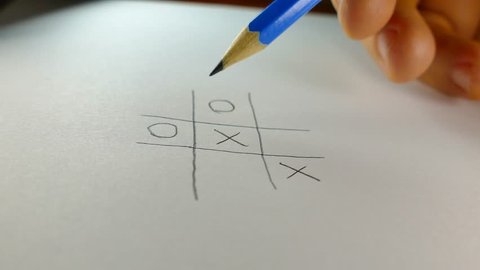 Tic-tac-toe playing on paper with a pencil.