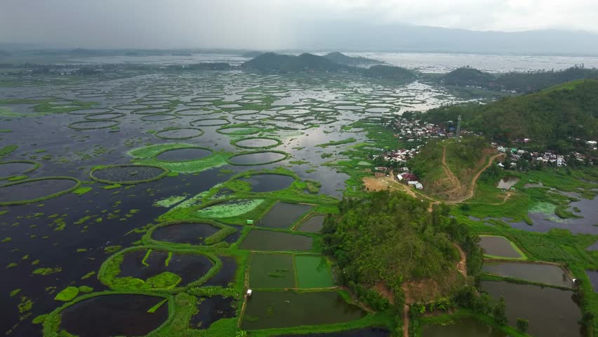 Aerial view loktak lake is the largest freshwater lake and thanga village in India as well as the largest lake in manipur north east India.