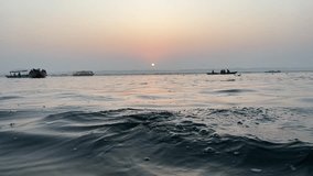 Sunrise view from the beautiful river ganga from the boat, River view, Selling boats, Kashi, Banaras Ghat. The beauty of Banaras 
