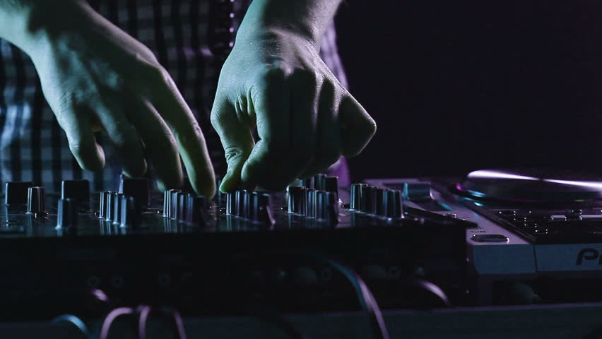 DJ using his mixer table