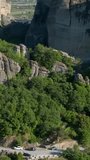 Monastery of Rousanou in famous Greek tourist destination Meteora in Greece on sunset with scenic landscape. Horizontal camera pan