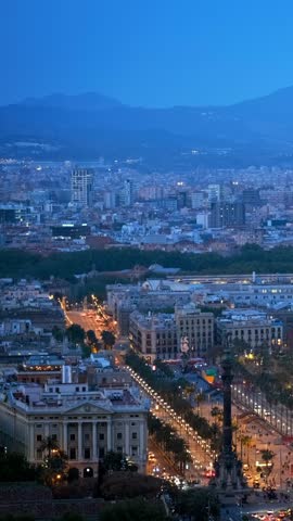 Aerial view of Barcelona city skyline with city traffic and port with yachts. Barcelona, Spain