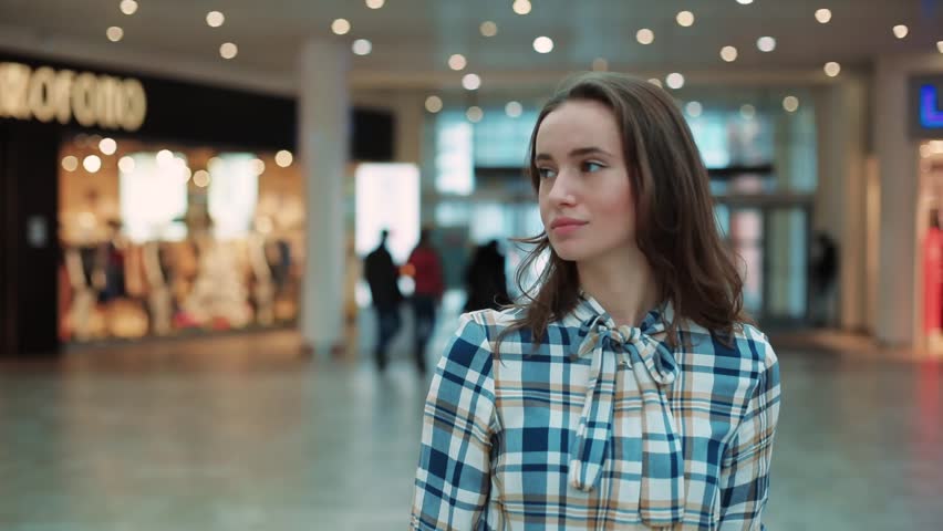 Attractive young woman look ar camera smiling feel happy in mall close up shopaholic clothing fashion person girl shopping money lifestyle store portrait weekend shop slow motion | Shutterstock HD Video #34793407