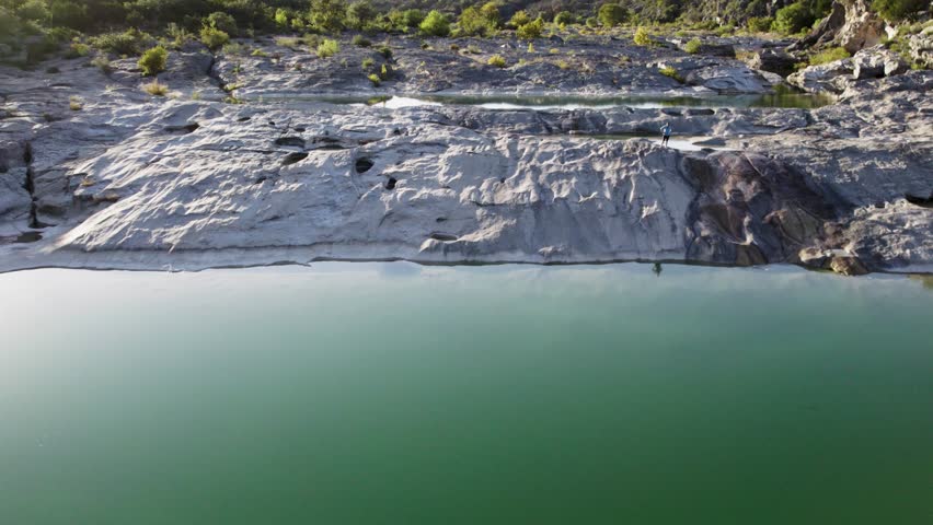 Epic drone shot of nature state park with waterfalls during sunset