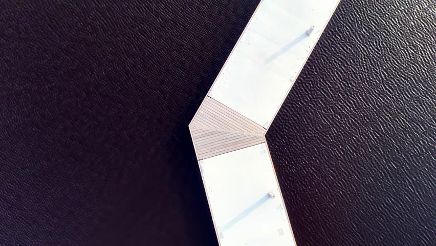 aerial top down scenographic bridge white wooden path walk over darl ocean sea water 