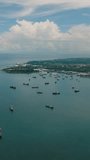 Costal sea bay with ship and boats in Zaboanga Peninsula. Mindanao, Philippines. Vertical video.