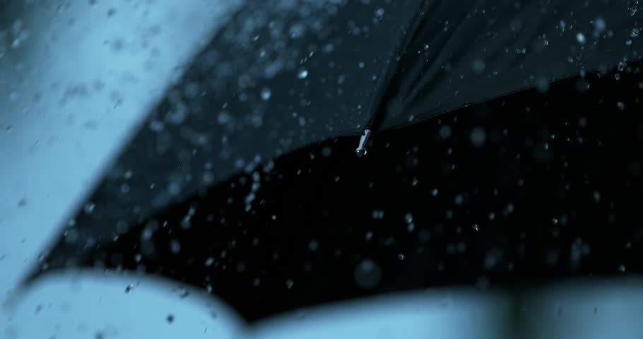 Rain slow motion dripping off black umbrella shot on Phantom Flex 4K
