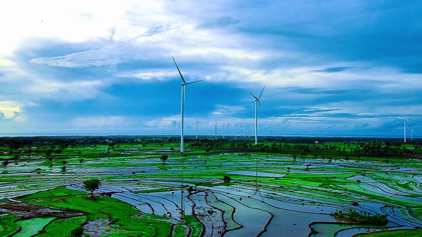 Aerial view of a wind-powered power plant that stops rotating after heavy rain
