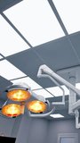 Switched on light in surgery room. Diverse bright illumination in modern operational theatre from low angle view. Circle footage. Vertical video