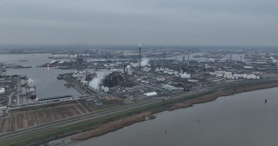 Petroleum industry, refinery, storage and processing of fossil fuels and products in the refinery of Antwerp, Belgium. Aerial drone view at night.