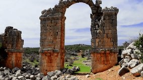 Panoramic video of Olba, Turkey, showcasing archaeology, ancient ruins. Footage highlights main gate, archaeology in detail. Explore archaeology of Roman city through sweeping views