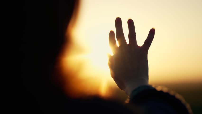 Silhouette of happy dreaming girl pulls her hand to sun.Religion helping hand. Happy girl pulls her hand.Prayer in religion.Silhouette of hand in sun.Happy girl silhouette at sunset.Freedom in nature Royalty-Free Stock Footage #3479635645