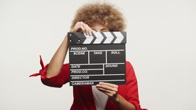 Filmmaker with Clapperboard Ready for Action
