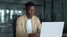 Busy Black business man employee or student using laptop. Serious professional African young company worker, male software developer typing on computer technology working elearning at office desk. - Powered by Shutterstock - Get 15% off with code: PIKWIZARD15
