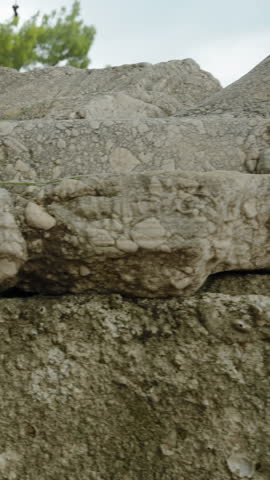 Vertical video. Ancient structure resembling a lion