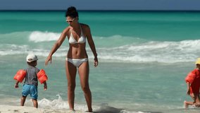 mother swims with children, family on vacation, vacation, family vacation at sea, children swim in the waves, small children - Powered by Shutterstock - Get 15% off with code: PIKWIZARD15