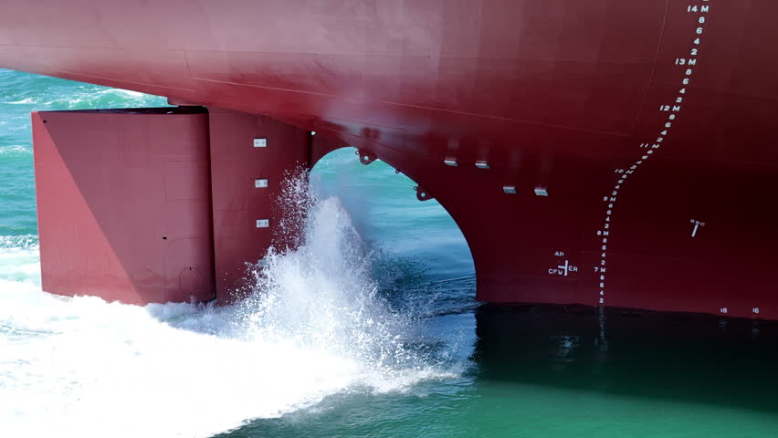 Propeller of large ship spinning power working and water splash contrail . Close up image detail Stern back of Vessel ship, Logistics Transportation industry express technology Freight 