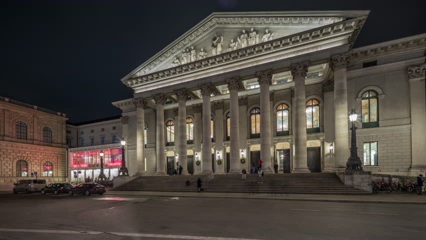 Munich National Theatre or Nationaltheater on the Max Joseph square night timelapse hyperlapse. Illuminated historic opera house front view, home of the Bavarian State Opera. Germany Royalty-Free Stock Footage #3479812753