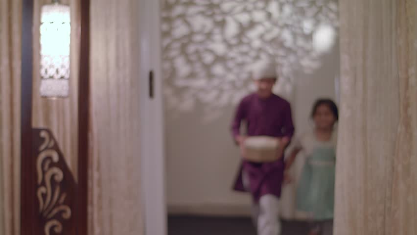 Cute Muslim Children come running to give surprise gifts to their parents on Eid Holiday