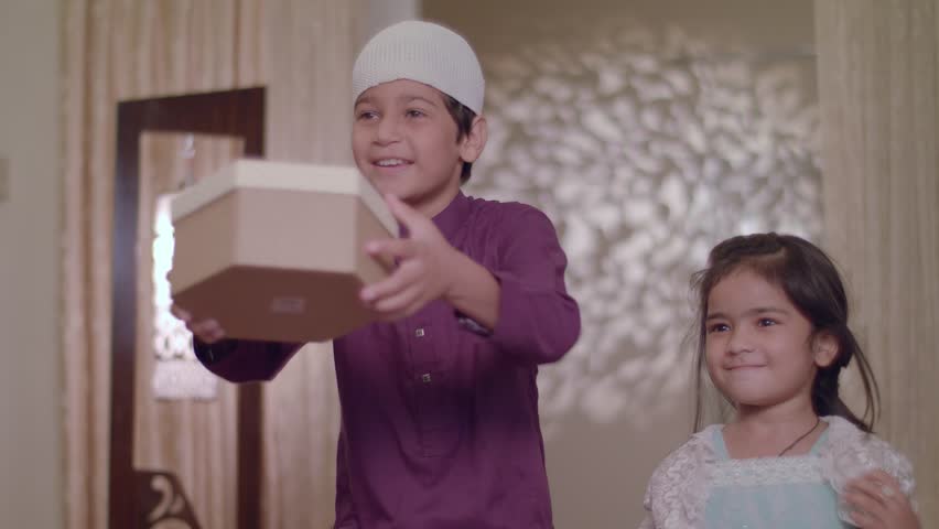 Cute Muslim Children come running to give surprise gifts to their parents on Eid Holiday