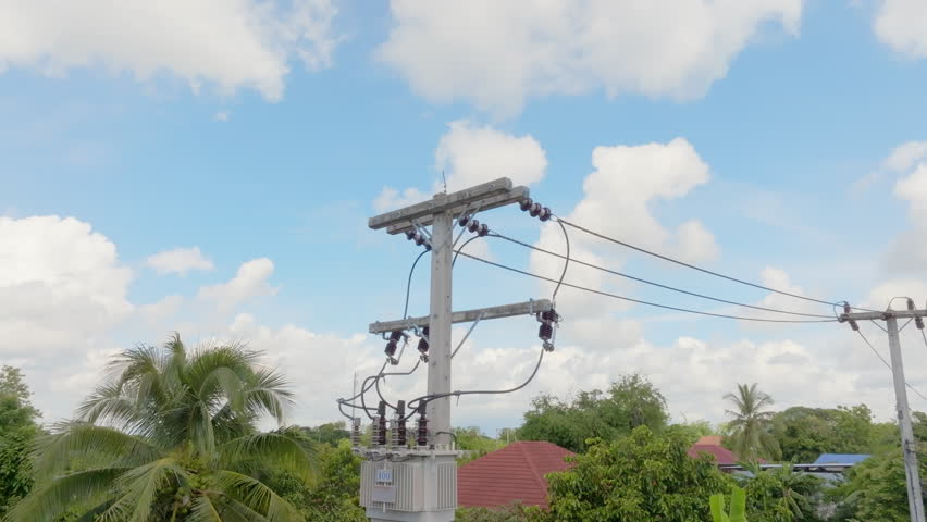 Power transformer mounted on pole in southeast asian. Royalty-Free Stock Footage #3479832385