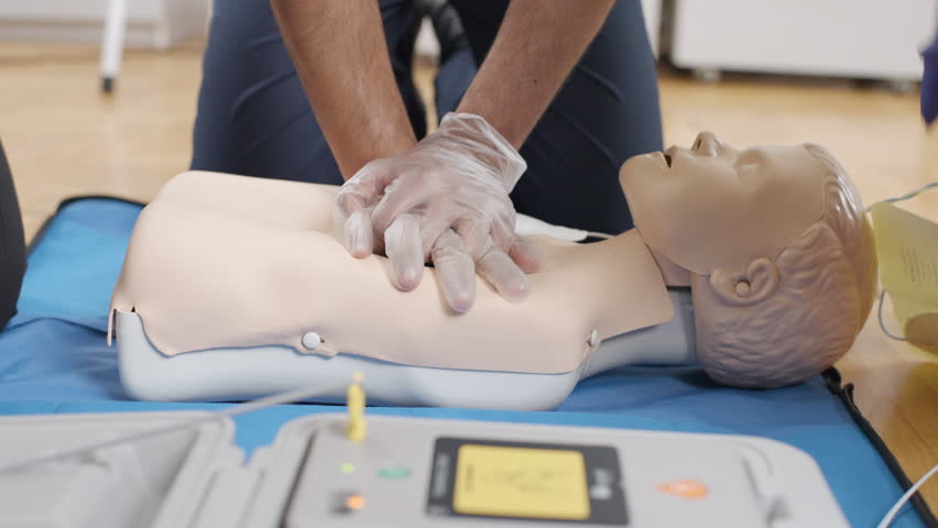 Medical procedure: practicing first aid on a mannequin