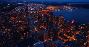 Night view of amazing modern metropolis. Aerial perspective on the well-illuminated city with lively traffic. Seattle, Washington, the USA.