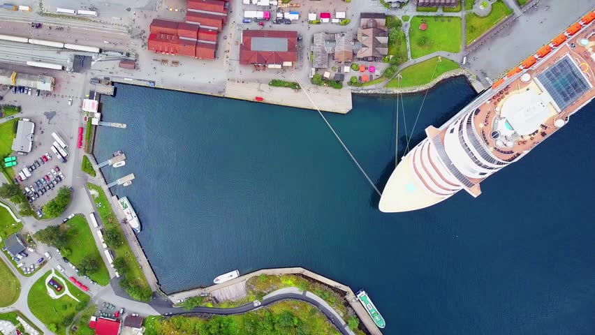 Cruise ship in Flam aerial view. Flam is a village in Flamsdalen, at the Aurlandsfjord a branch of Sognefjord, municipality of Aurland, Norway. Royalty-Free Stock Footage #3479990809
