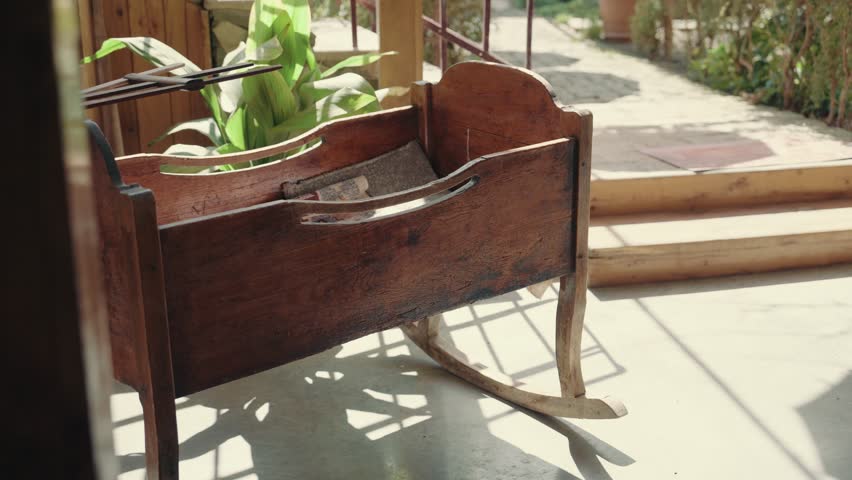 Vintage empty wooden cradle from the 19th century. A sense of antiquity Royalty-Free Stock Footage #3479998785
