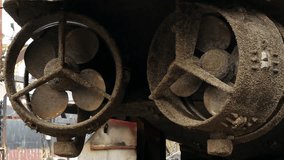 Corroded ship propellers await refurbishment in dry dock. Marine repair, vessel maintenance process captured, showcasing rust-eaten blades, maritime industry maintenance at shipyard. - Powered by Shutterstock - Get 15% off with code: PIKWIZARD15