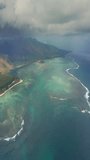 Close up fly over palm trees and beautiful beach lagoon. Paradise island in Mauritius. Landscape view along the coastline. Aerial view of the beach in Mauritius bright sunny day in paradise island