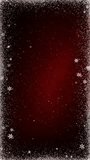 Vertical Snow Frame Christmas Dark Red 4K Loop features a dark red background with white particles and snowflakes emanating from the edges to make a frame in a vertical ratio loop. 