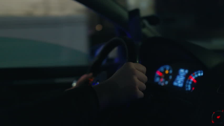 Nocturnal Journey: Experience the solitude of the night drive, the driver's hands steady on the wheel as they traverse the quiet streets.