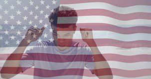 Animation of light spots and american flag over happy biracial man dancing on sunny beach. America, summer, vacations, healthy lifestyle, celebration and patriotism, digitally generated video.