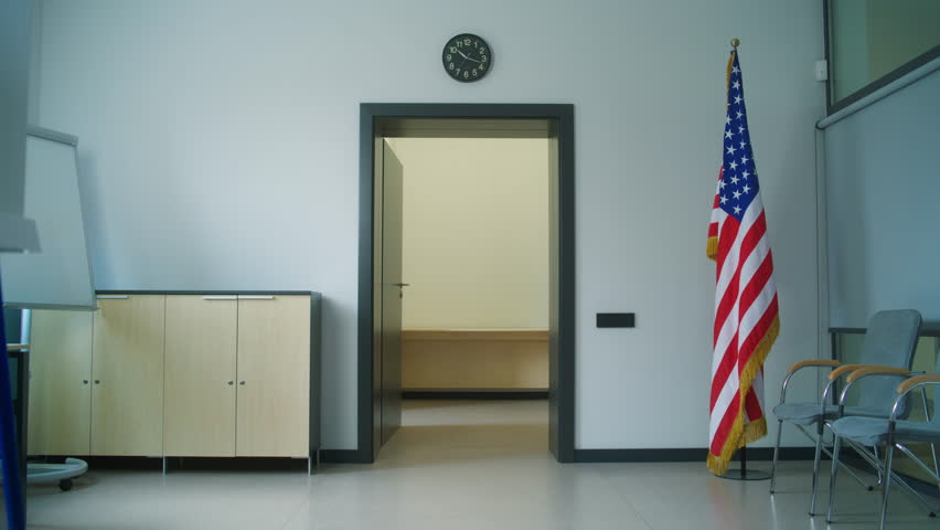 African American male voter exits the elevator in government building and walks to polling station during elections. US citizen on National Elections Day in the United States of America. Civic duty.