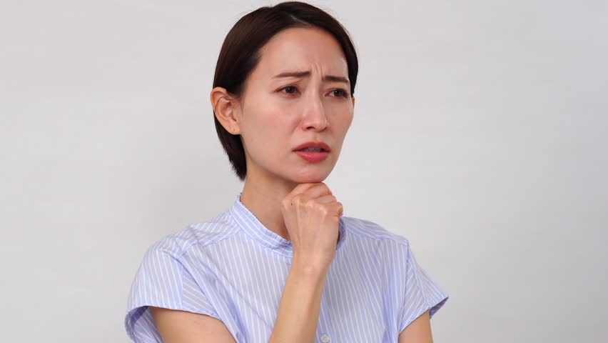 Angry Asian woman in white background Royalty-Free Stock Footage #3480192681