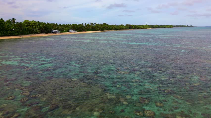 Marshall islands - 3.18.2024 - beautiful aerial footage moving over a lagoon in the marshall islands.