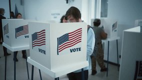 Asian woman comes to vote in booth in polling station office. National Election Day in the United States. Political races of US presidential candidates. Concept of civic duty. Slow motion. Dolly shot. - Powered by Shutterstock - Get 15% off with code: PIKWIZARD15