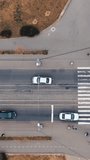 Aerial view of bridge traffic. Tracking the car that goes to the bridge. Vertical video.