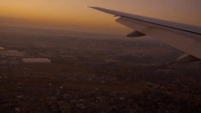 4K footage airplane landing in South Africa . wing of an airplane flying above Johannesburg. beautiful aerial view of from the window of plane on travelling time by aircraft. holiday ,vacation time - Powered by Shutterstock - Get 15% off with code: PIKWIZARD15