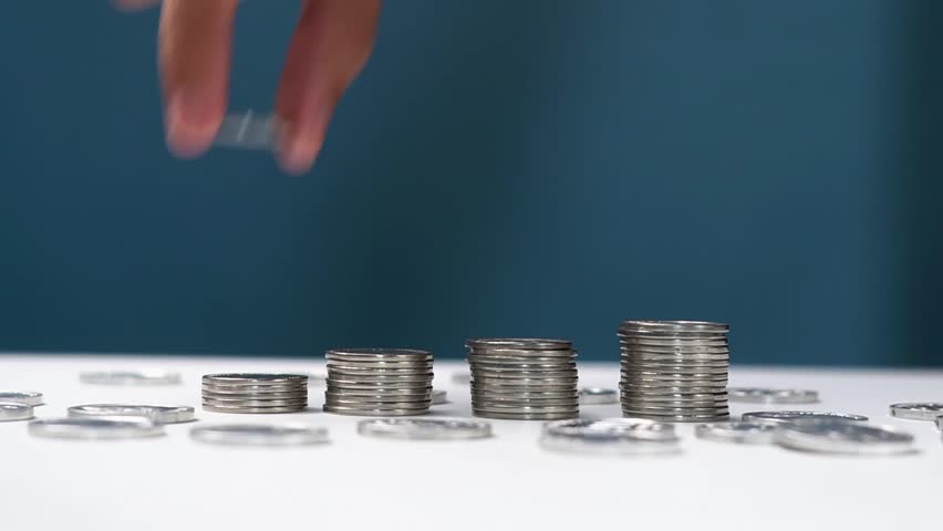 Man's hands counting money, close up. Concept of financial wealth, saving money and arranging coins. Personal financial accountability.