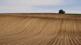 Short clip of ploughed field up to horizon line