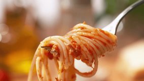 Spaghetti Bolognese Winding Onto a Fork - from a View of the Entire Dish on the Plate to a Close-up of the Strands of Pasta on the Utensil - Powered by Shutterstock - Get 15% off with code: PIKWIZARD15
