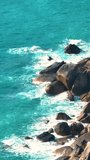 Drone aerial view over long rocky coastline. Top Down View. Aerial vertical background, vertical video background, vertical video. 