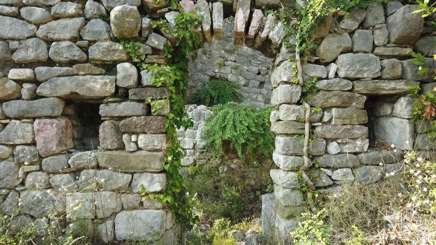Wall with medieval masonry and doorway in the historic Old Town of Bar, Montenegro