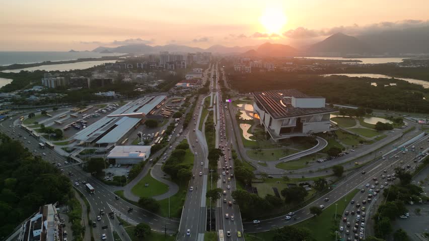 Aerial View of Americas Avenue, Alvorada Bus Terminal, and Cidade das Artes Cultural Complex in Rio de Janeiro on Sunset