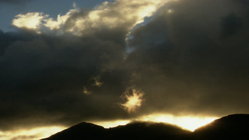 sunset over mountain and clouds