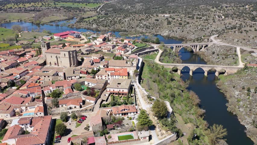 Scenic aerial cityscape of Ledesma town and Tormes river at spring, Salamanca region, western Spain
