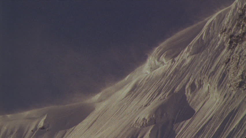 Snow being blown off mountain top