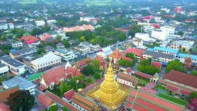 Aerial view beautiful Thai temple at northern Thailand,Top view from drone flight over countryside at northern Thailand,4K video resolution top view from drone flight.
